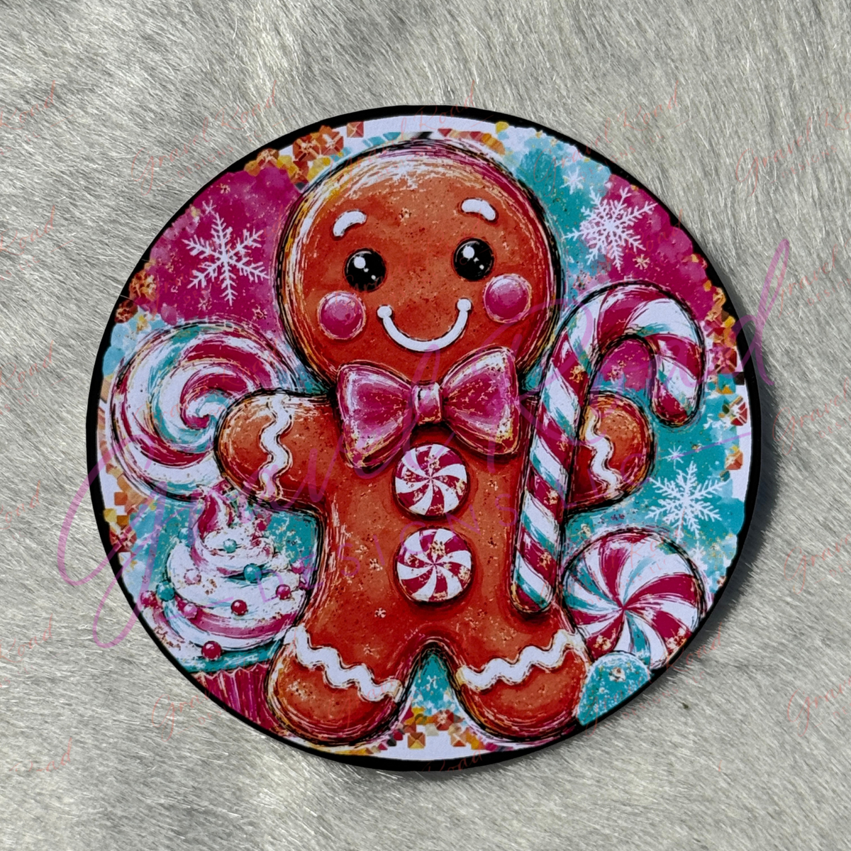A round printed cardstock featuring a colorful gingerbread man illustration with candy canes, a cupcake, and snowflakes. Displayed on a gray textured background.