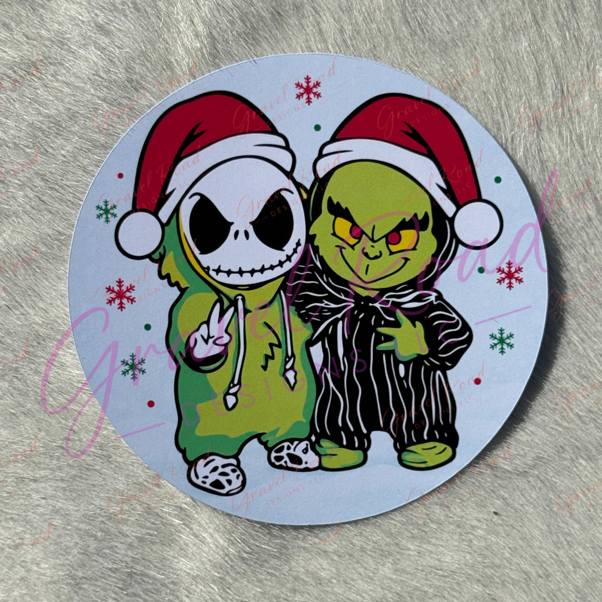 A round cardstock featuring Jack and the g in Christmas outfits, displayed on a gray faux fur background.