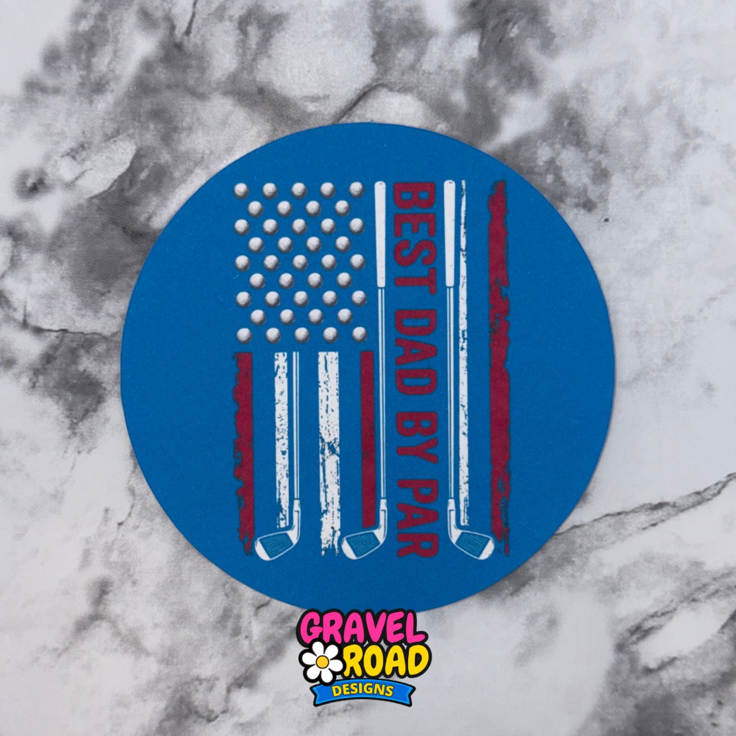 Blue round cardstock with American flag design and text 'Best Dad by Par' on a marble background, featuring Gravel Road Designs logo.