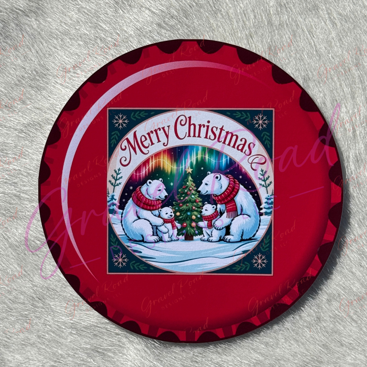 A festive Christmas cardstock featuring two adult polar bears and two cubs wearing red scarves gathered around a decorated Christmas tree topped with a star, set against a snowy landscape with evergreen trees and colorful aurora lights, with the phrase “Merry Christmas” above the scene. Displayed on a faux fur background.
