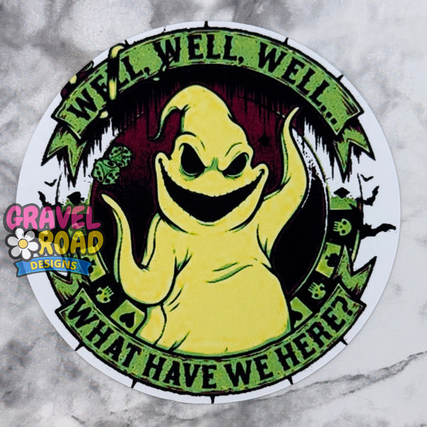 A circular cardstock featuring a yellow ghost with the text 