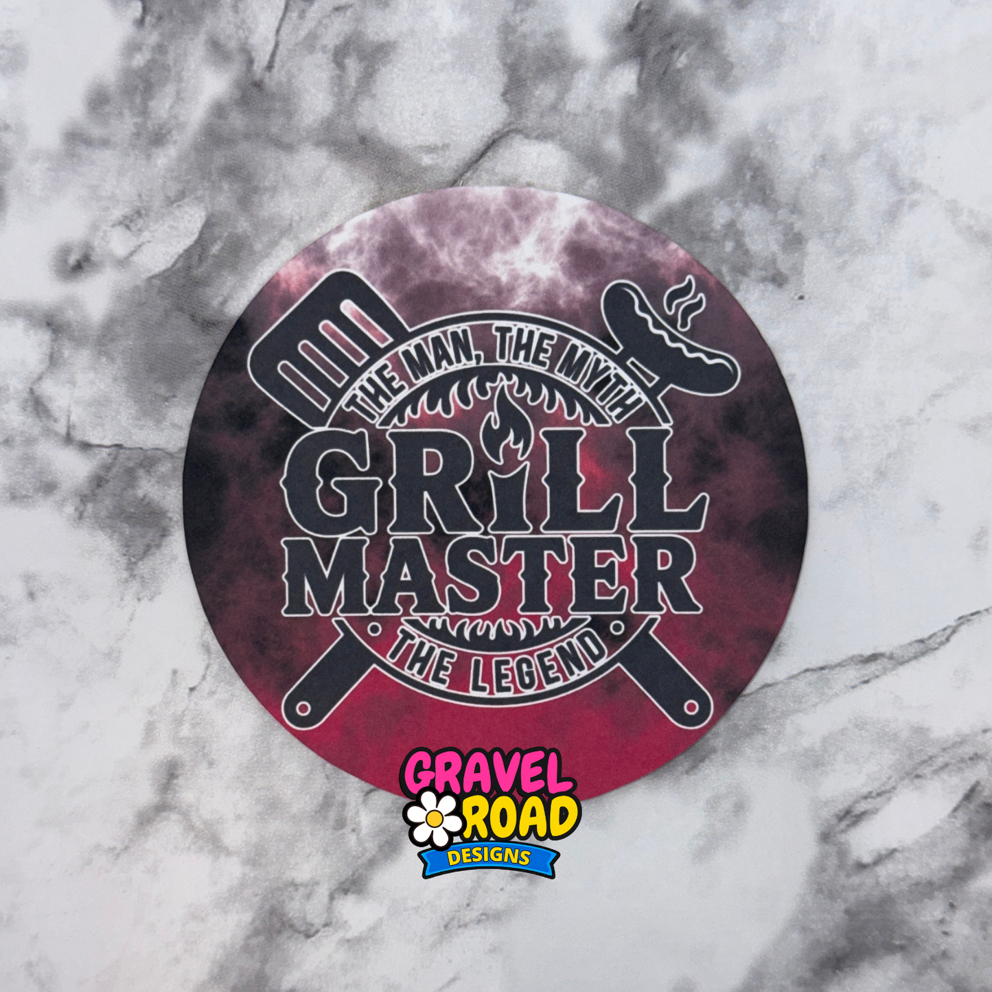 Round cardstock with fire and smoke background with 'Grill Master' design on a marble background