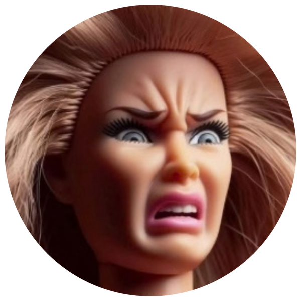 A close-up circular photo of a doll or toy character with an angry, shocked expression, brown hair, and pale skin against a black background.