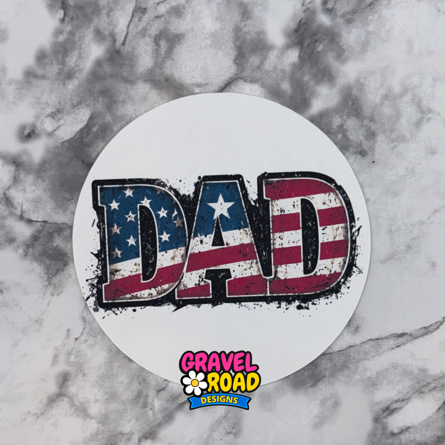 Round cardstock with 'DAD' text in American flag design on a marble background