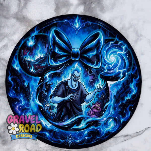 A circular custom graphic print featuring a cartoon style man, styled in a tattoo flash design with a large glowing blue bow on a marble background. The artwork is signed by Gravel Road Designs in the bottom-left corner. On a grey marble backdrop.