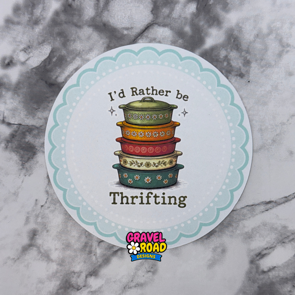 Round sticker with colorful pots and text 'I'd Rather be Thrifting' on a marble background