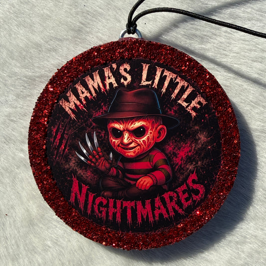 Cartoon character‑style horror freshie with a glittery red border, black hanging cord, and “Mama’s Little Nightmares” text on a red splatter background.
