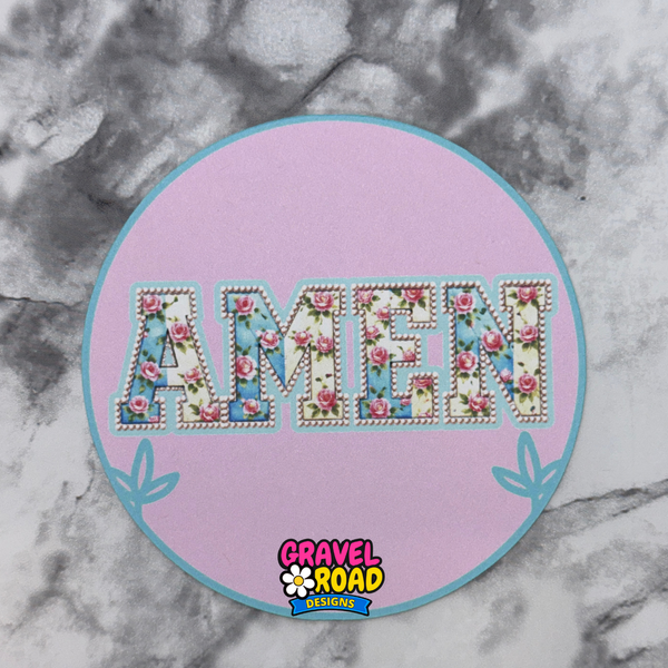 Decorative patch printed cardstockwith floral 'AMEN' text on a pink circle, branded 'Gravel Road Designs', on a marble background.