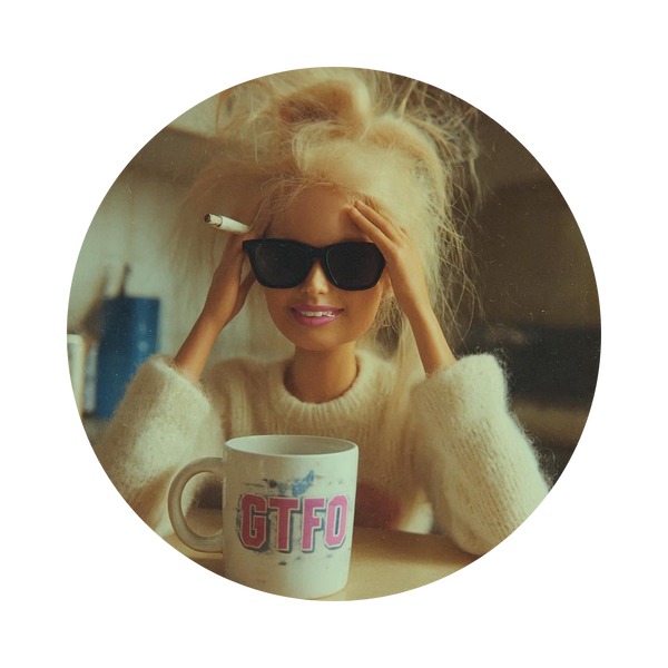 A circular vintage-style photograph of a blonde woman wearing black sunglasses and a cream knit sweater, holding a cigarette near her face, with a white mug featuring the text 'GTFO' in the foreground. The circular image is centered on a solid white background.