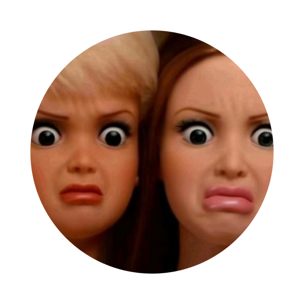 A circular close-up of two dolls or figurines with exaggerated cartoon eyes and distressed expressions, shown against a plain white background.