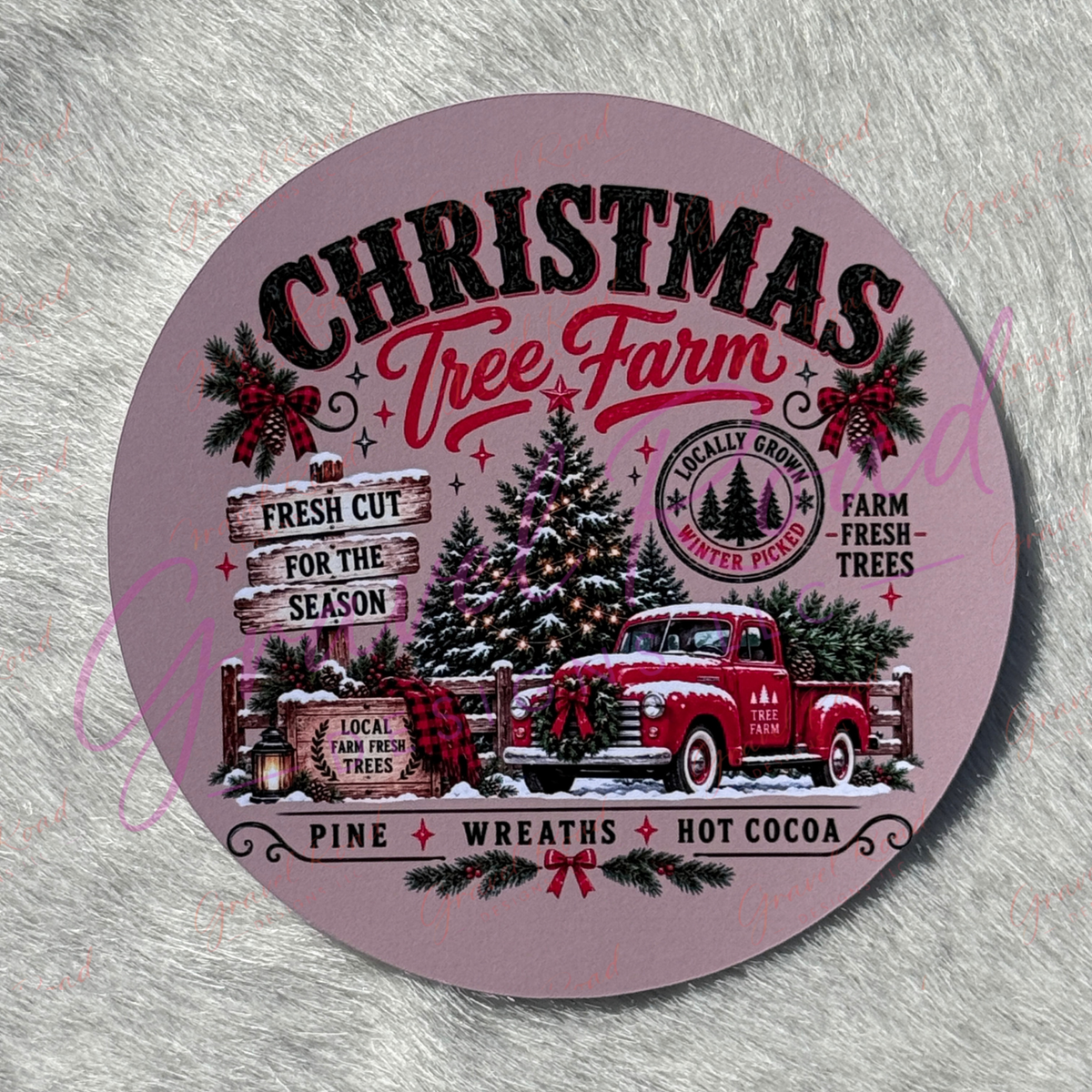 A festive Christmas tree farm cardstock featuring a red vintage pickup truck decorated with a wreath, parked beside snow‑covered evergreen trees and a wooden fence, with text advertising “Christmas Tree Farm,” “Fresh Cut for the Season,” “Local Farm Fresh Trees,” and other rustic holiday phrases. Display on faux fur background.