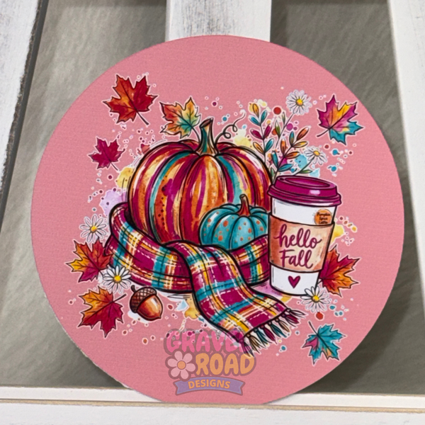 Round pink fall cardstock featuring colorful pumpkins, a plaid scarf, autumn leaves, flowers, and a “Hello Fall” coffee cup.