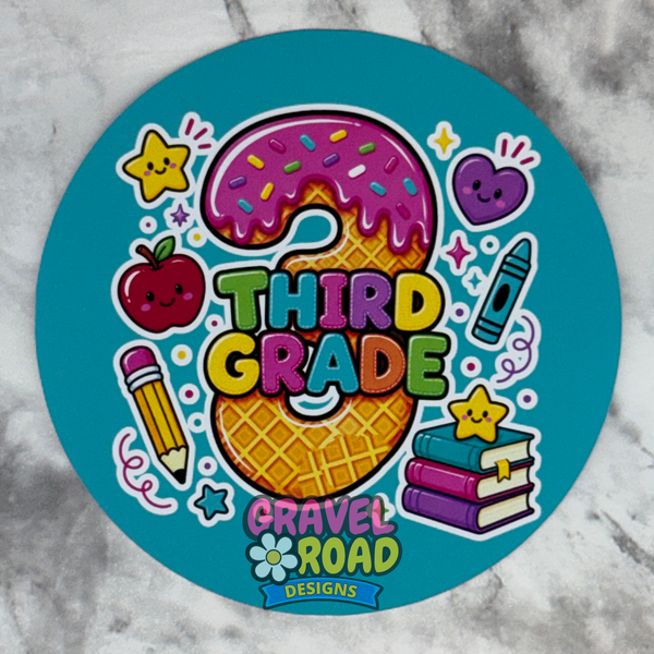 A round teal cardstock featuring a colorful 'Third Grade' design with an apple, pencil, crayon, books, and stars on a marble surface.