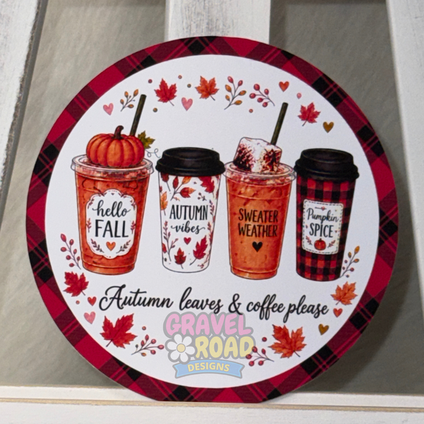 Round fall cardstock featuring four autumn-themed coffee cups, colorful leaves, and the phrase “Autumn leaves & coffee please.”