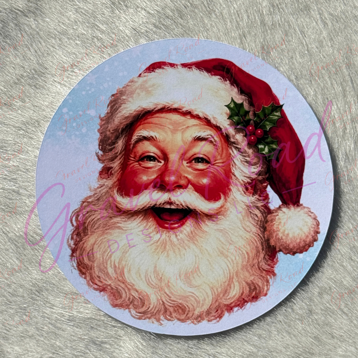 A round printed cardstock featuring a vintage-style illustration of Santa Claus with a red hat, white beard, and small holly sprig. Displayed on faux fur background.