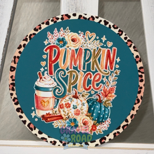 Round teal fall cardstock with a leopard-print border, pumpkins, flowers, a coffee cup, and the phrase “Pumpkin Spice.”