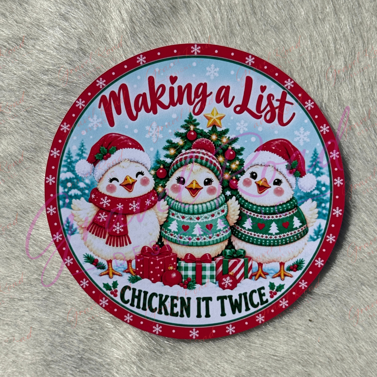 A round Christmas-themed cardstock featuring three cartoon chickens wearing Santa hats and sweaters around a decorated tree, with the text 'Making a List' and 'CHICKEN IT TWICE' on a gray faux-fur background.